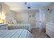 Bright guest bedroom with twin beds and ample closet space at 1001 Benjamin Franklin Dr # 110, Sarasota, FL 34236