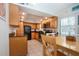 Well-equipped kitchen featuring wood cabinets and stainless steel appliances at 1001 Benjamin Franklin Dr # 110, Sarasota, FL 34236