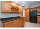 Kitchen boasts granite countertops and wood cabinets at 1001 Benjamin Franklin Dr # 110, Sarasota, FL 34236