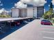 Covered parking area with numerous parking spots at 1001 Benjamin Franklin Dr # 110, Sarasota, FL 34236