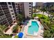 Inviting pool and spa area with lounge chairs at 1001 Benjamin Franklin Dr # 110, Sarasota, FL 34236