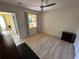 Well-lit bedroom with a large window and light wood floors at 1010 Villagio Cir # 207, Sarasota, FL 34237