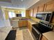 Kitchen boasts modern appliances and ample cabinetry at 1010 Villagio Cir # 207, Sarasota, FL 34237