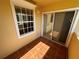 Private patio with terracotta tile flooring and sliding glass doors at 1010 Villagio Cir # 207, Sarasota, FL 34237