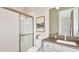 Clean bathroom with a walk-in shower and modern vanity at 10157 Silent Night Ln, Sarasota, FL 34241