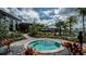 Relaxing hot tub surrounded by lush landscaping at 10157 Silent Night Ln, Sarasota, FL 34241