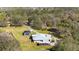 Aerial view of a home on a large lot with a pool and detached garage at 11701 Marsh Head Road, Sarasota, FL 34240