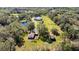 Aerial view of property with two houses and a pond at 11701 Marsh Head Road, Sarasota, FL 34240