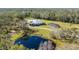 Aerial view of home, pool, and surrounding area at 11701 Marsh Head Road, Sarasota, FL 34240