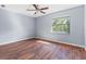 Bright bedroom with wood floors and a window view at 11701 Marsh Head Road, Sarasota, FL 34240