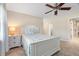 Bedroom with white furniture and a ceiling fan at 11701 Marsh Head Road, Sarasota, FL 34240