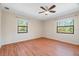 Spacious bedroom with hardwood floors and large windows offering natural light at 11701 Marsh Head Road, Sarasota, FL 34240