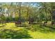 Chicken coops and run in a sunny grassy area at 11701 Marsh Head Road, Sarasota, FL 34240