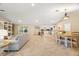 Bright dining room with a wooden table and chairs, open to the kitchen and living area at 11701 Marsh Head Road, Sarasota, FL 34240