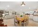 Open concept dining room with built-in shelving and kitchen views at 11701 Marsh Head Road, Sarasota, FL 34240