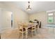 Charming dining area featuring a farmhouse style table and chairs at 11701 Marsh Head Road, Sarasota, FL 34240