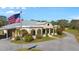 Spanish style home with covered porch and flag at 11701 Marsh Head Road, Sarasota, FL 34240