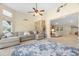 Gathering room with sectional sofa, ceiling fan, and views into the main living area at 11701 Marsh Head Road, Sarasota, FL 34240