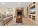 Living room with stone fireplace and built-in shelving at 11701 Marsh Head Road, Sarasota, FL 34240