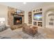 Living room with stone fireplace and built-in shelving at 11701 Marsh Head Road, Sarasota, FL 34240