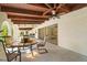 Covered porch with seating area and ceiling fan at 11701 Marsh Head Road, Sarasota, FL 34240