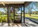 Spacious screened porch with view of the backyard and countryside at 11701 Marsh Head Road, Sarasota, FL 34240