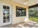 Cozy screened porch with tiled floor, providing a peaceful outdoor space at 11701 Marsh Head Road, Sarasota, FL 34240