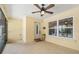 Screened porch entry with tiled floor and ceiling fan at 11701 Marsh Head Road, Sarasota, FL 34240