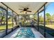 Relaxing screened porch with patio furniture and leafy view at 11701 Marsh Head Road, Sarasota, FL 34240