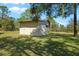 Detached storage shed in a grassy backyard at 11701 Marsh Head Road, Sarasota, FL 34240