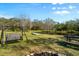 Peaceful yard with fire pit, swing, and pond view at 11701 Marsh Head Road, Sarasota, FL 34240