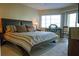 King-size bed in spacious bedroom with large window and workspace at 1215 S Portofino Dr # 108, Sarasota, FL 34242