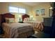 Two twin beds in a well-lit guest bedroom with beach themed art at 1215 S Portofino Dr # 108, Sarasota, FL 34242