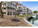 Building exterior with water access and landscaping at 1215 S Portofino Dr # 108, Sarasota, FL 34242