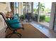 Relaxing sunroom with comfy seating, providing peaceful outdoor views at 1215 S Portofino Dr # 108, Sarasota, FL 34242