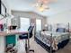 Spacious bedroom with a queen bed and home office at 12455 Trailhead Dr, Bradenton, FL 34211