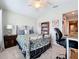 Bedroom with queen-size bed, bookshelf, and home office at 12455 Trailhead Dr, Bradenton, FL 34211