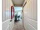 Hallway with mirror and access to bedroom and office at 12455 Trailhead Dr, Bradenton, FL 34211