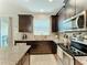 Modern kitchen with stainless steel appliances and granite countertops at 12455 Trailhead Dr, Bradenton, FL 34211