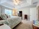 Main bedroom with a king-size bed, ceiling fan, and ample closet space at 12455 Trailhead Dr, Bradenton, FL 34211