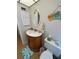 Well-appointed bathroom with vanity, toilet and decorative accents at 1318 56Th W St # 1318, Bradenton, FL 34209