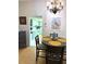 Bright dining area with kitchen view, round table and four chairs at 1318 56Th W St # 1318, Bradenton, FL 34209