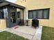 Cozy patio with table, chairs, and umbrella, adjacent to the house at 1318 56Th W St # 1318, Bradenton, FL 34209