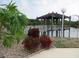 Gazebo over the lake with lush landscaping at 1318 56Th W St # 1318, Bradenton, FL 34209