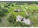 Aerial view of property showing two homes and expansive grounds at 15409 Waterline Rd, Bradenton, FL 34212