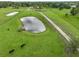 Aerial view of property with pond and pasture at 15409 Waterline Rd, Bradenton, FL 34212