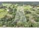 Aerial view showing a house with large lot and pond at 15409 Waterline Rd, Bradenton, FL 34212