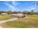 Aerial view of a ranch-style house with a spacious yard at 15409 Waterline Rd, Bradenton, FL 34212