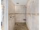 Walk-in shower with pebble floor and modern fixtures at 15409 Waterline Rd, Bradenton, FL 34212