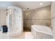 Modern bathroom with a large walk-in shower and a corner soaking tub at 15409 Waterline Rd, Bradenton, FL 34212